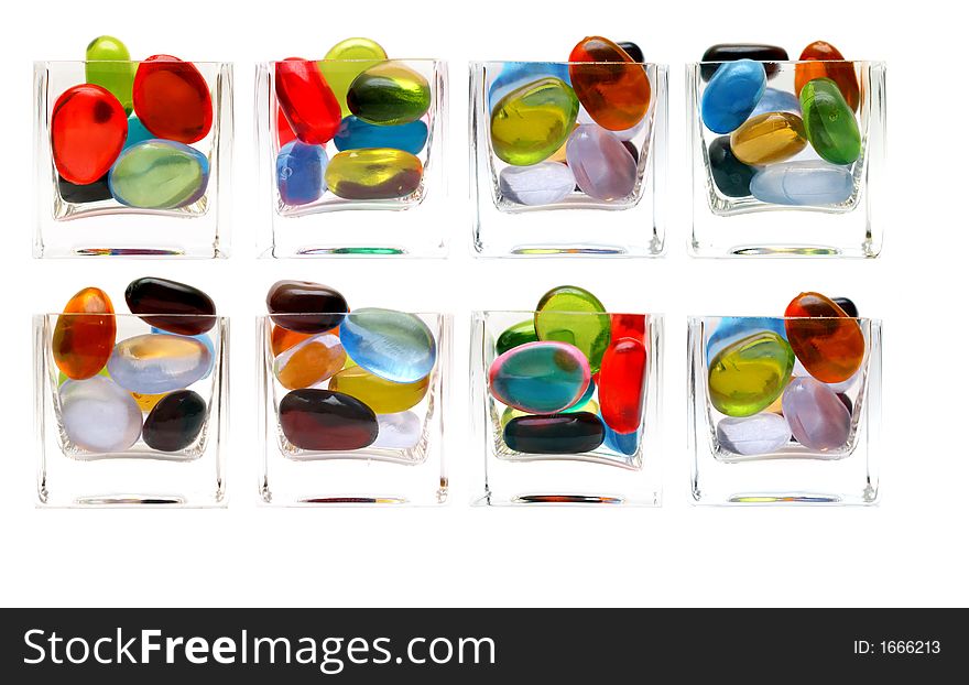 Eight differents glass with colorful pebbled isolated over white