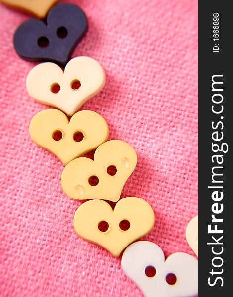 A line of buttons for Valentine's Day.  It seems like around Valentine's Day everything is shaped like hearts. A line of buttons for Valentine's Day.  It seems like around Valentine's Day everything is shaped like hearts.