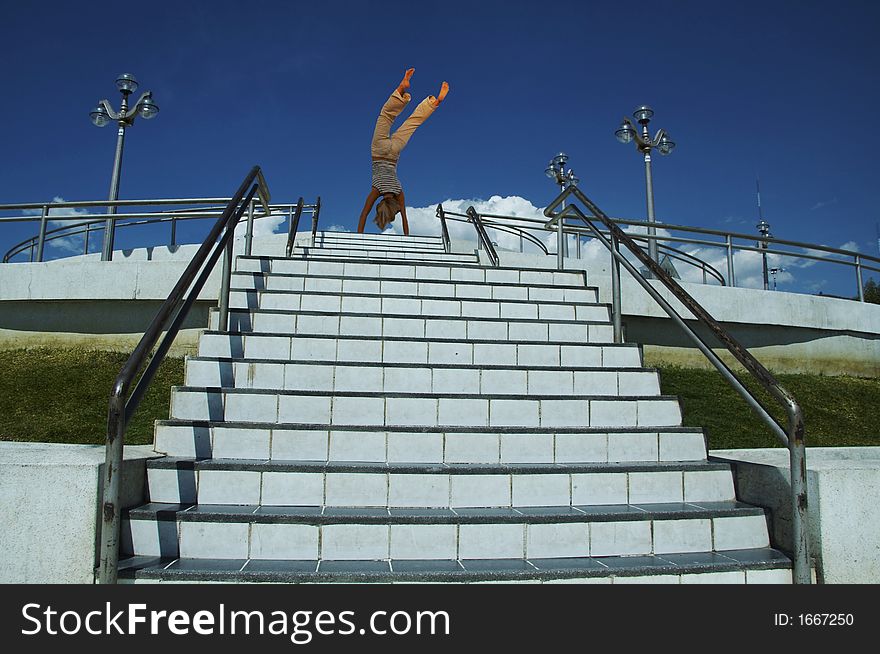 Cartwheel on the white steps on street