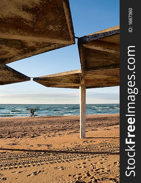 Concrete tent on a background of winter beach. Concrete tent on a background of winter beach