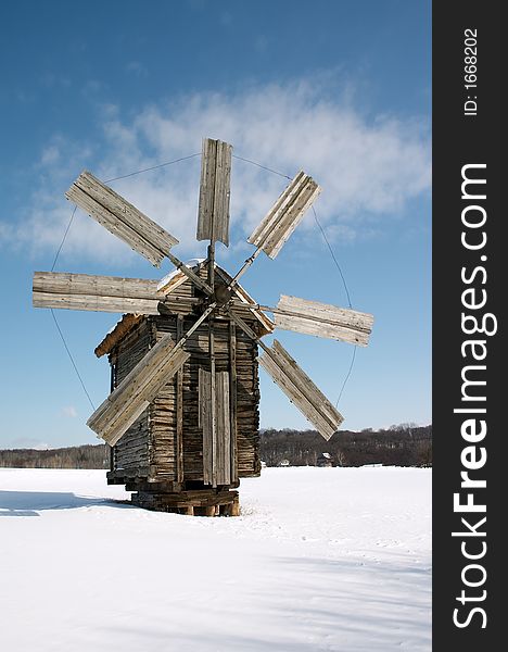 Windmill on snow plain