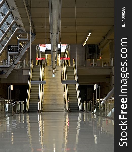 Escalators at a nearly empty urban metro station