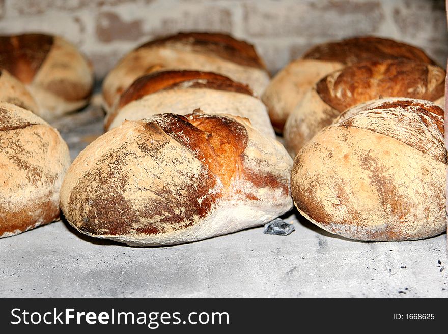 Several loafs of bread inside the oven