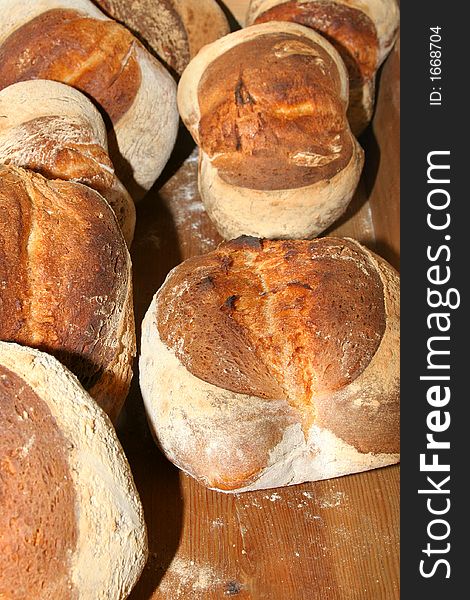 Several loafs of bread fresh made cooling down