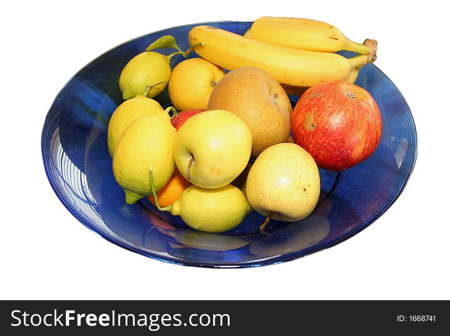 Blue bowl with various fruits inside isolated over white