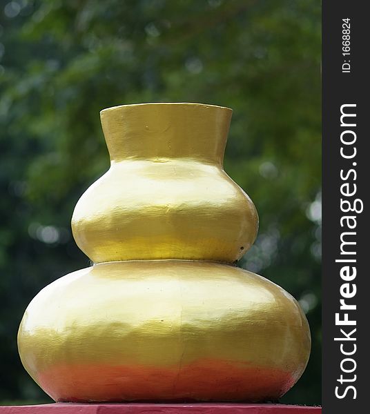 Golden vase at Chinese style Buddhist temple in Thailand. Golden vase at Chinese style Buddhist temple in Thailand