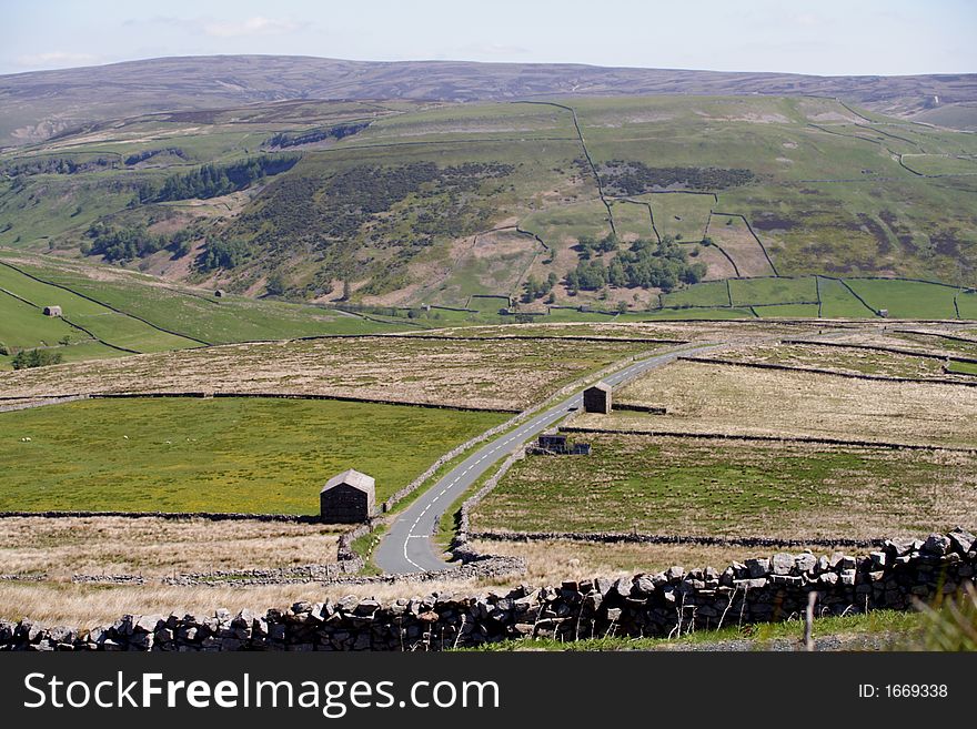 The Buttertubs Pass is a high road in the Yorkshire Dales. The road winds its way from Muker and Thwaite, North Yorkshire near 20 metre deep limestone potholes called the Buttertubs.
