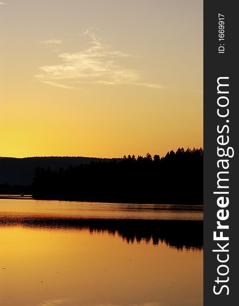 Sunrise over a quiet lake. Sunrise over a quiet lake.