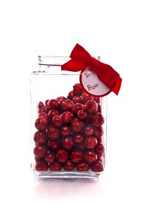Candy Jar With Red Glittery Candy, And Gift Tag Royalty Free Stock Photography Candy Jar With Red Glittery Candy, And Gift Tag Royalty Free Stock Photography