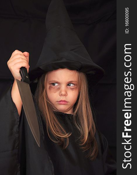 Masked girl in witch for Halloween. Masked girl in witch for Halloween