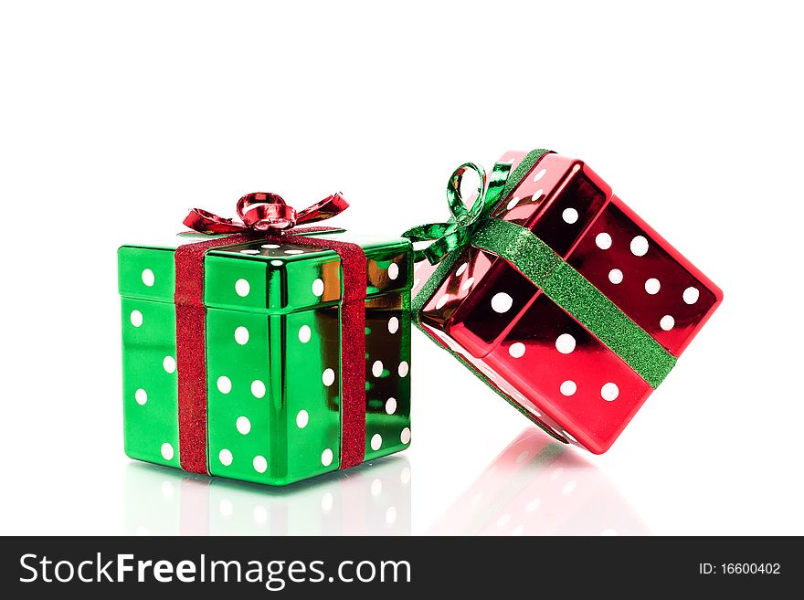 Two shiny polka dot red and green Christmas presents. Two shiny polka dot red and green Christmas presents.