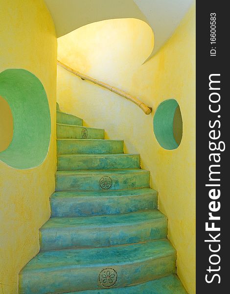 Bright yellow and blue stairway with tropical flair