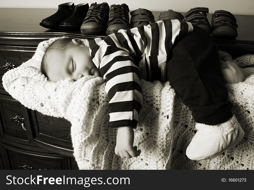 Month old baby boy sleeping in a drawer. Month old baby boy sleeping in a drawer