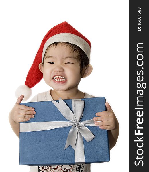 Portrait of a little girl with santa hat and gift. Portrait of a little girl with santa hat and gift