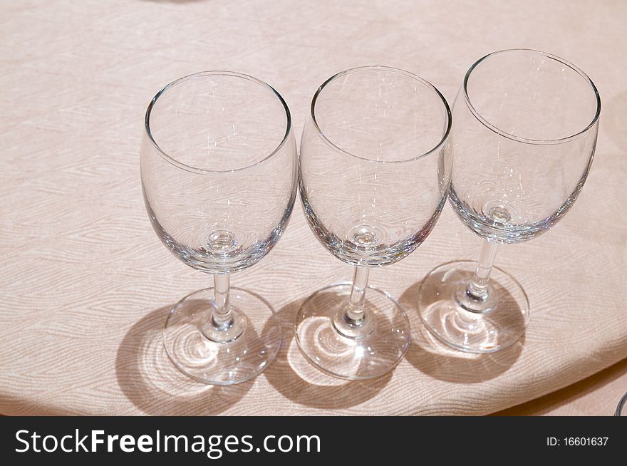 The three empty goblets under light