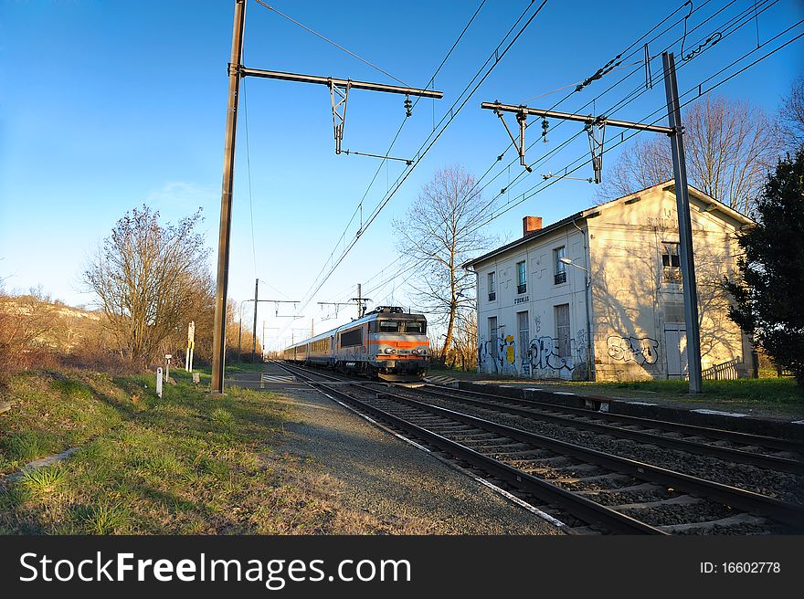 A passing train in a disused train station