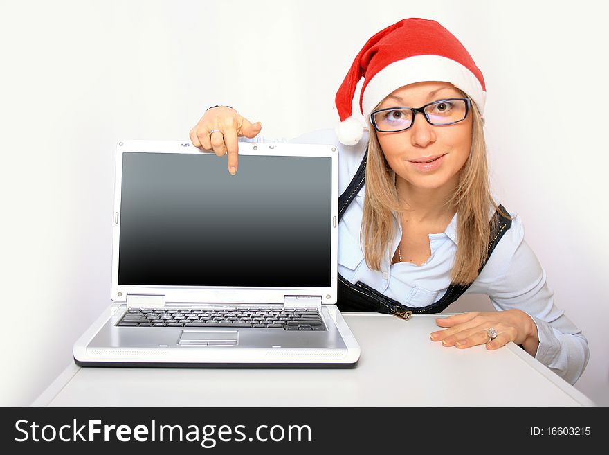 Portrait of a young businesswoman with a red Santa hat