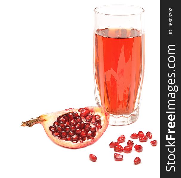 Pomegranate juice in a glass isolated on a white background.