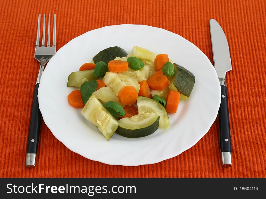 Boiled vegetables  on an white plate