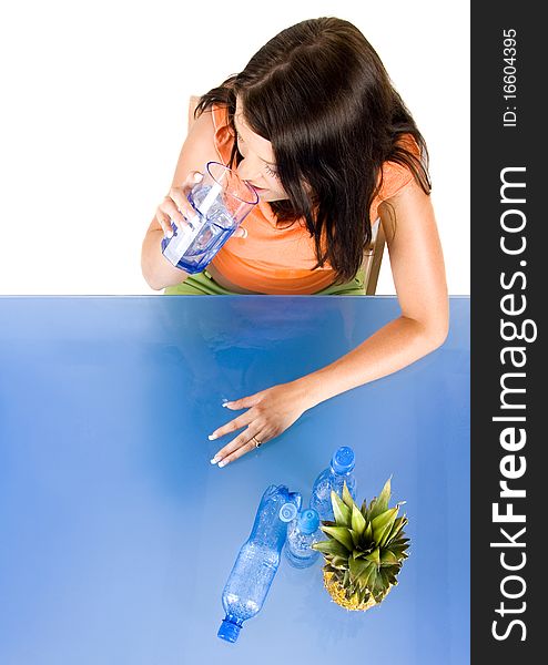 Woman drinking healthy mineral water.Demonstration of healthy nutrition. Woman drinking healthy mineral water.Demonstration of healthy nutrition