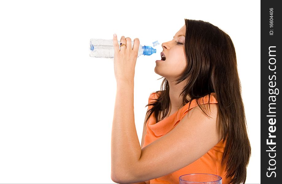 Woman drinking healthy mineral water.Demonstration of healthy nutrition. Woman drinking healthy mineral water.Demonstration of healthy nutrition