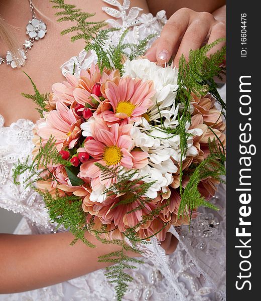 Wedding bouquet at bride's hands