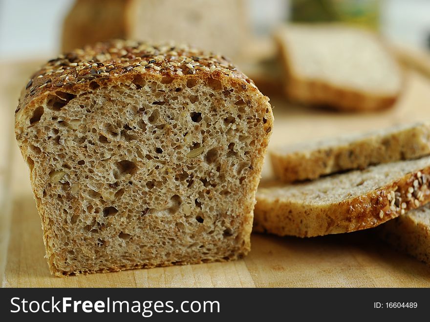 Sliced bread with grains on the board