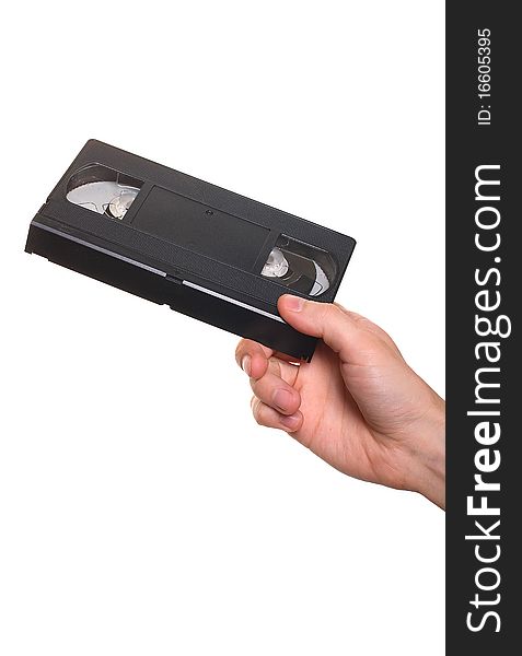 Video cassette VHS in hand isolated over white. Video cassette VHS in hand isolated over white