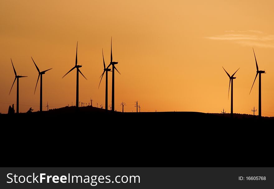 Wind turbines at sunset