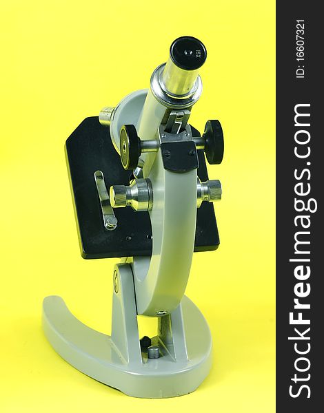 Microscope on a yellow background