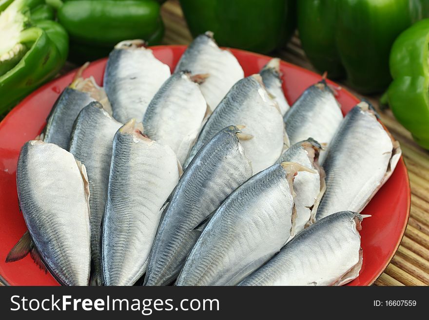 A dish of fresh fishes on white