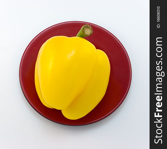 Large, sweet, juicy,
Yellow pepper lies on a brown plate. Large, sweet, juicy,
Yellow pepper lies on a brown plate.