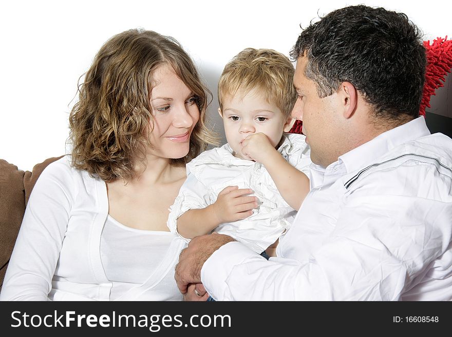 Young happy family of three over white