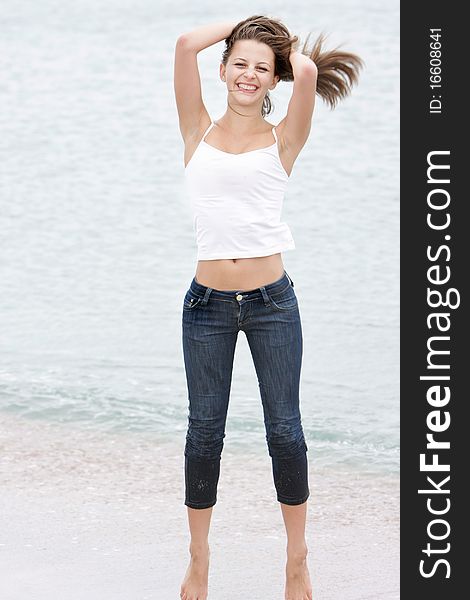 Young happy woman on beach