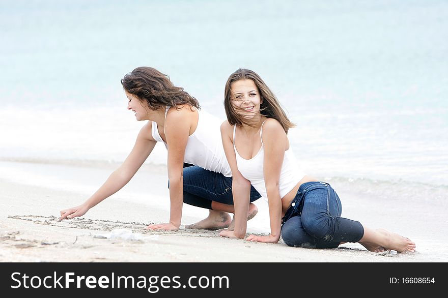 Young happy girls on beach