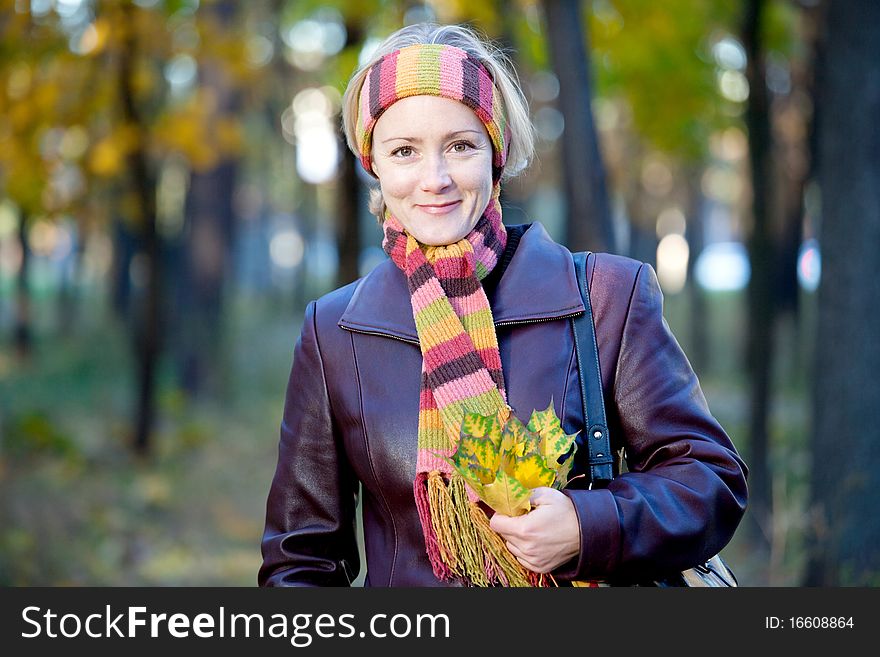 Young woman in autumn park