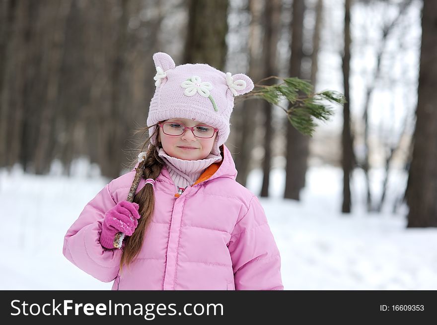 Adorable winter small girl in glasses