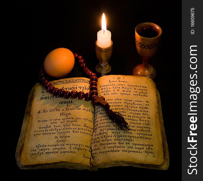 Prayer Book by candlelight in the shade. Prayer Book by candlelight in the shade.