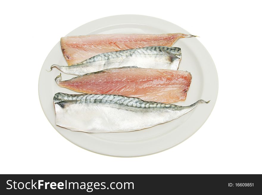 Four raw mackerel fillets on a plate isolated against white