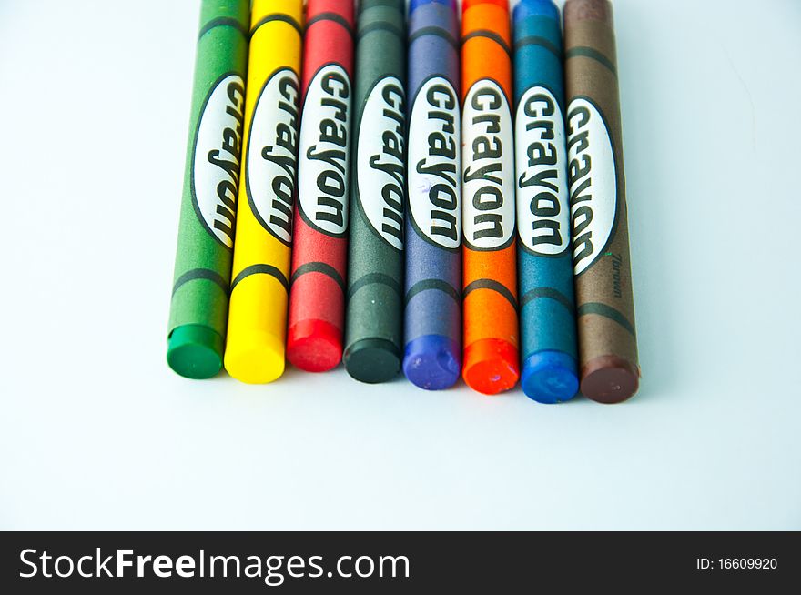 Colorful crayons on white background