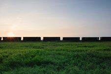 Railroad Grain Cars In The Prairies With Blue Sky Stock Photo Railroad Grain Cars In The Prairies With Blue Sky Stock Photo
