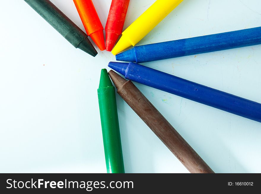 Colorful crayons on white background