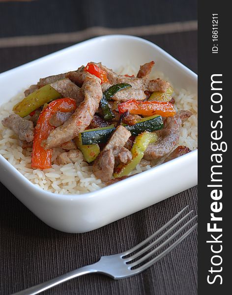 Sweet and sour pork stir fry with rice. Sweet and sour pork stir fry with rice