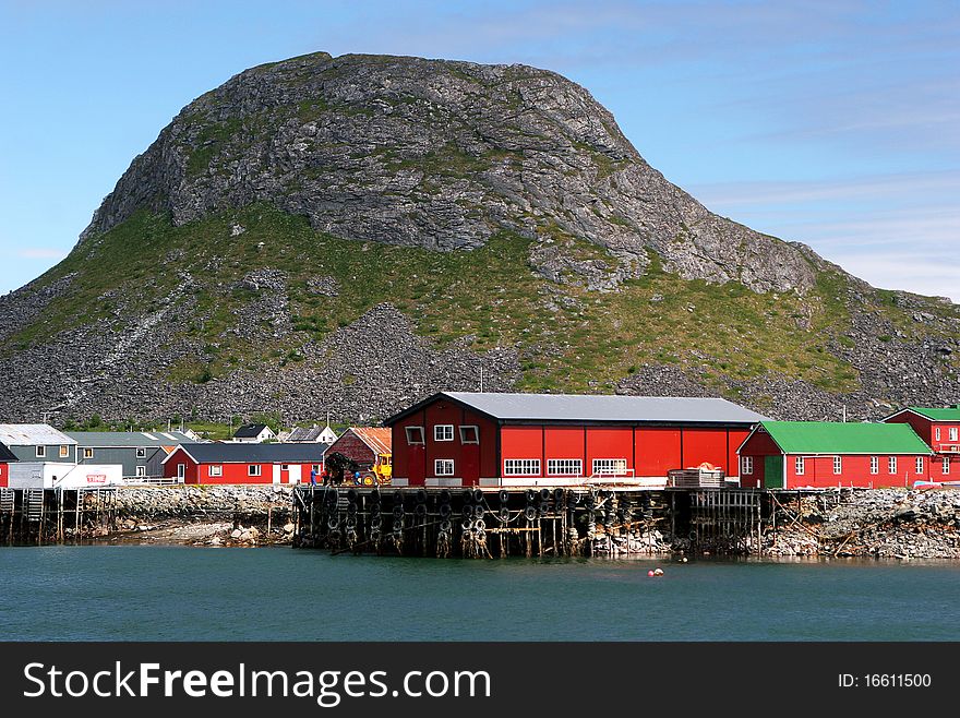 Red houses with wooden pier