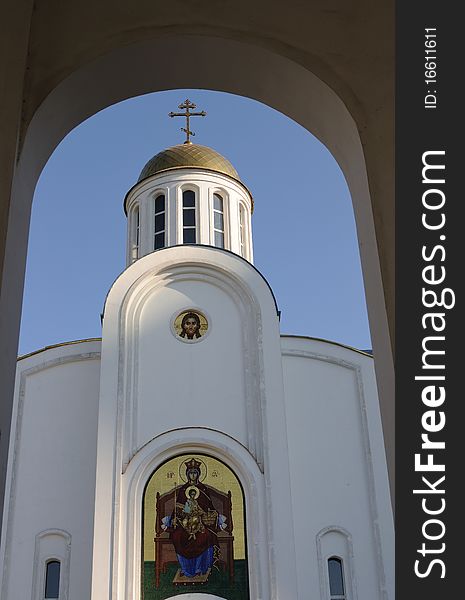 White orthodox church - arch of the chapel forms a beautiful frame