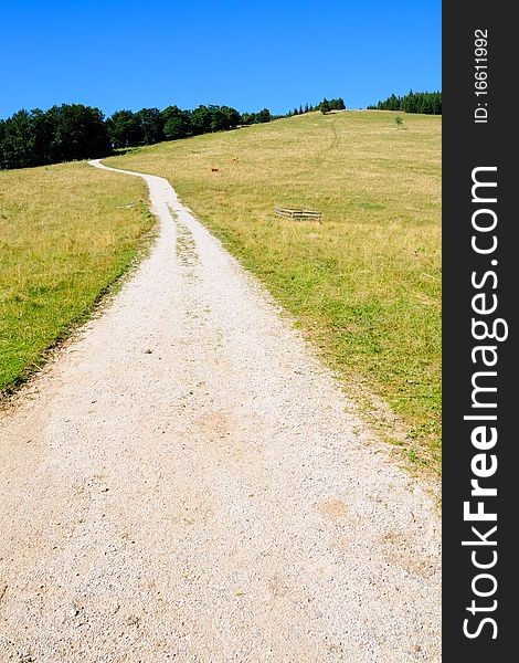 A gravel road on the grassland of the Reisalpe in Lower Austria. A gravel road on the grassland of the Reisalpe in Lower Austria