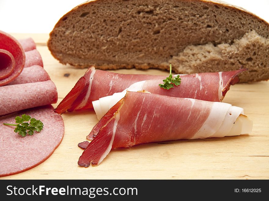 Raw ham and salami with bread