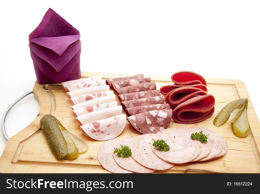 Different sausage sorts with parsley and gherkin