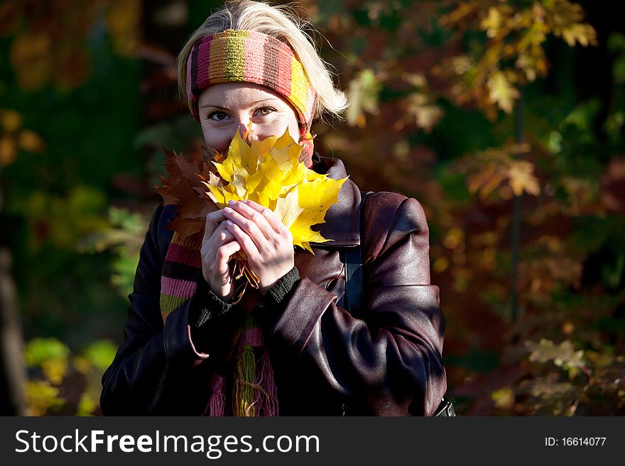 Portait of young woman in autumn park