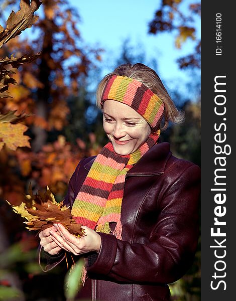 Portait of young woman in autumn park